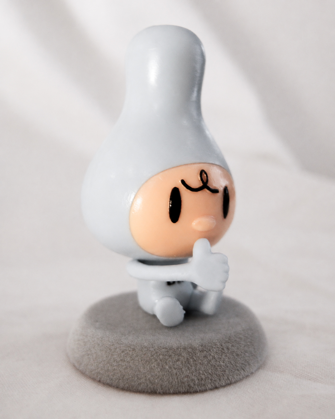 Tear-colored Gourmette-chan figure presented with the press kit