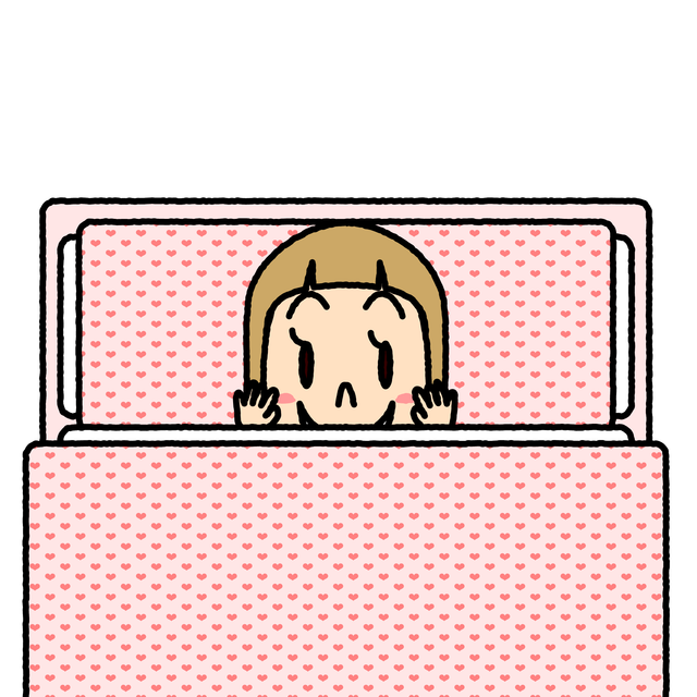 ピンクの掛け布団から顔をのぞかせるヴィクトワールちゃん